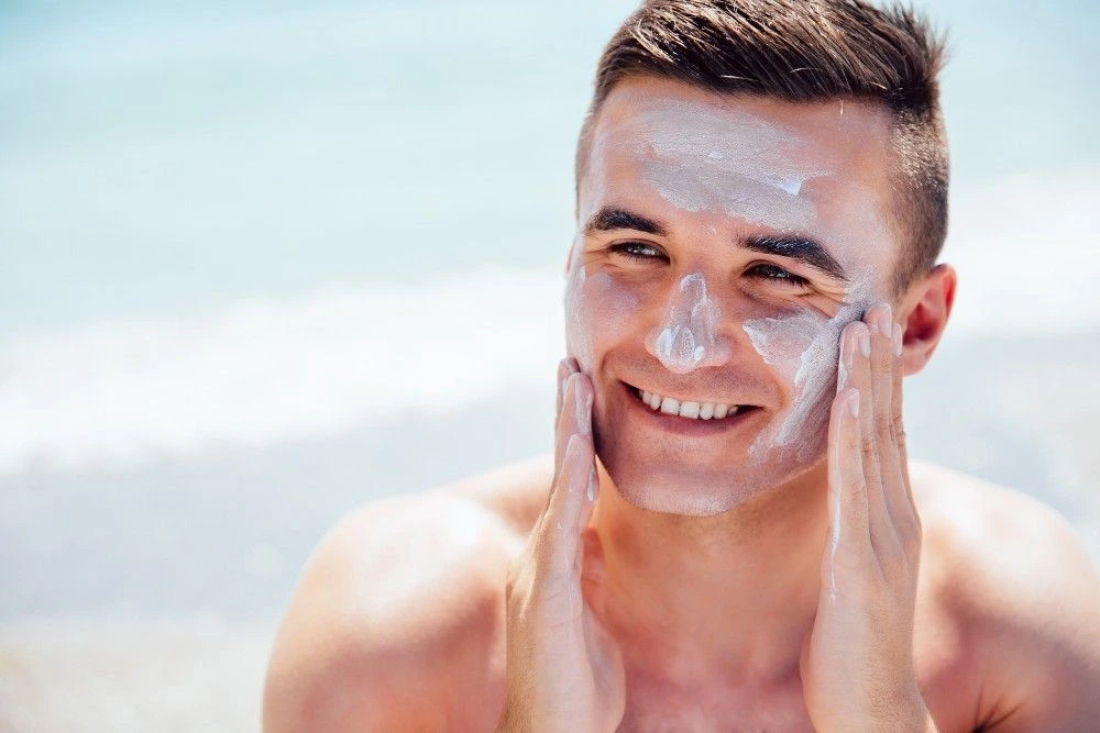 Man Applying Sunscreen